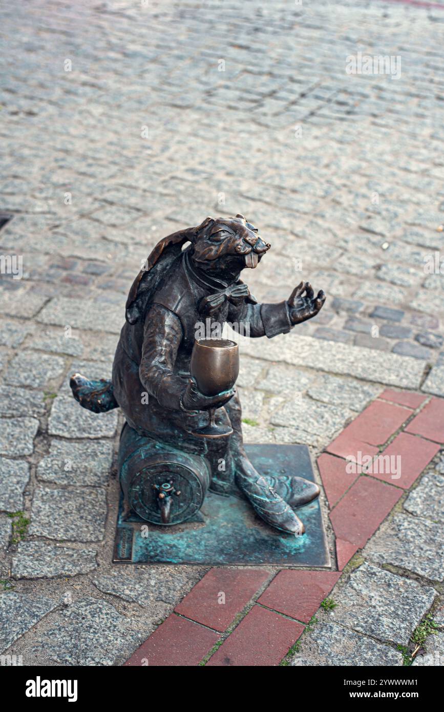 A quirky sculpture of a rabbit holding a beer, located in the city ...