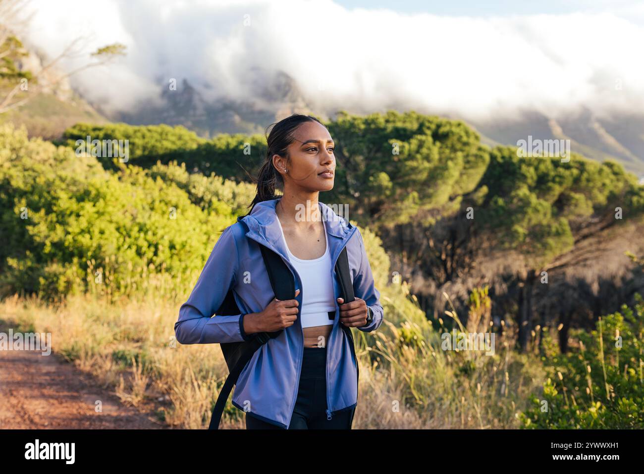 Young woman watching sunset hi-res stock photography and images - Alamy