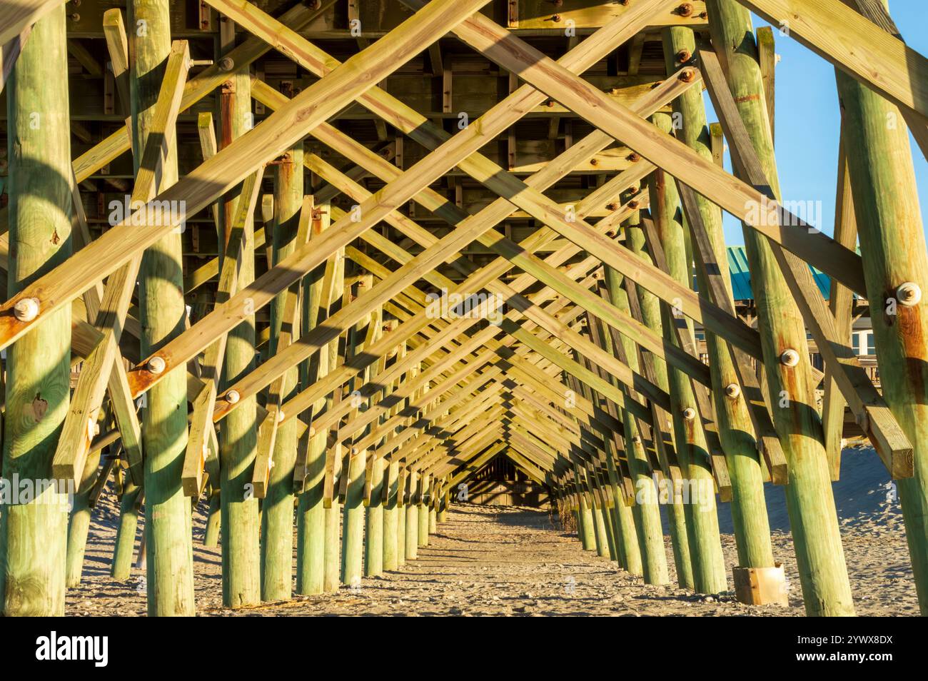 Underneath View of Pier Construction with Geometric Patterns Stock Photo