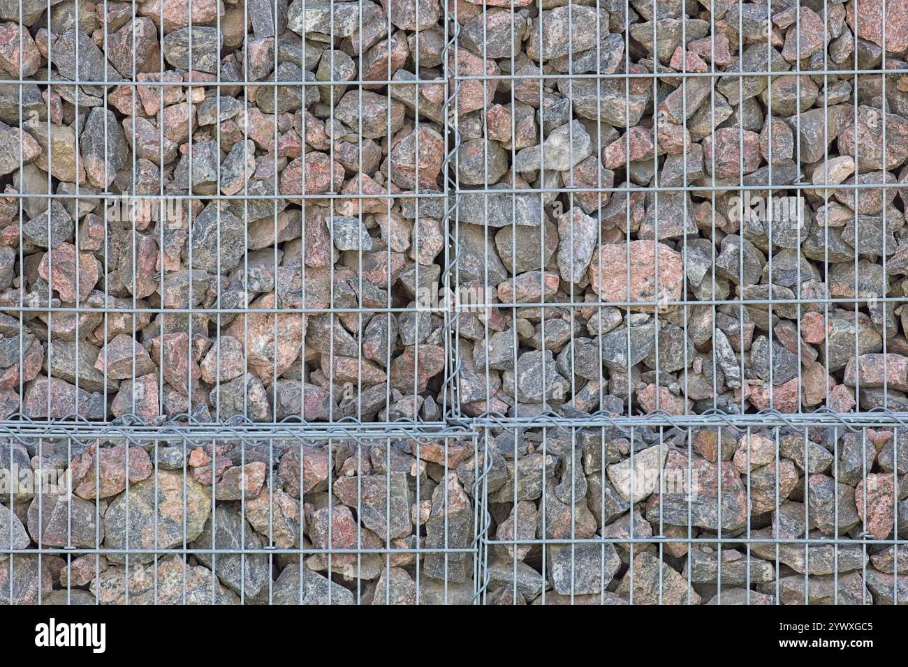 Closeup of metal cage filled with rocks to make a cage. Texture ...