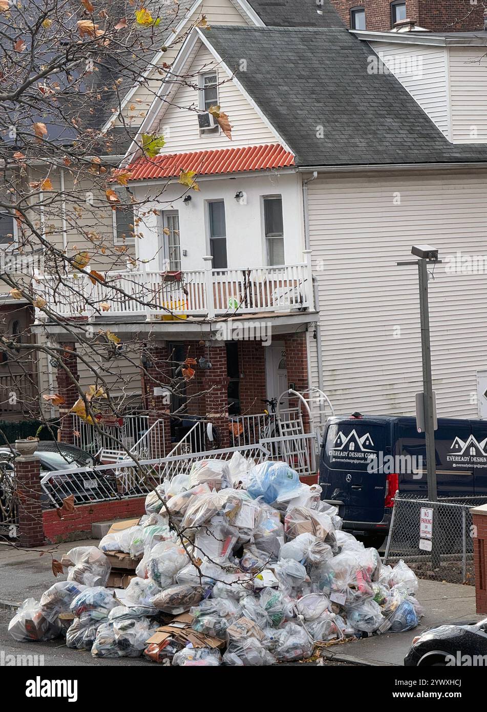 Mountain of recycling garbage waiting to be picked up by New York City sanitation in a residential neighborhood in Brooklyn. Stock Photo