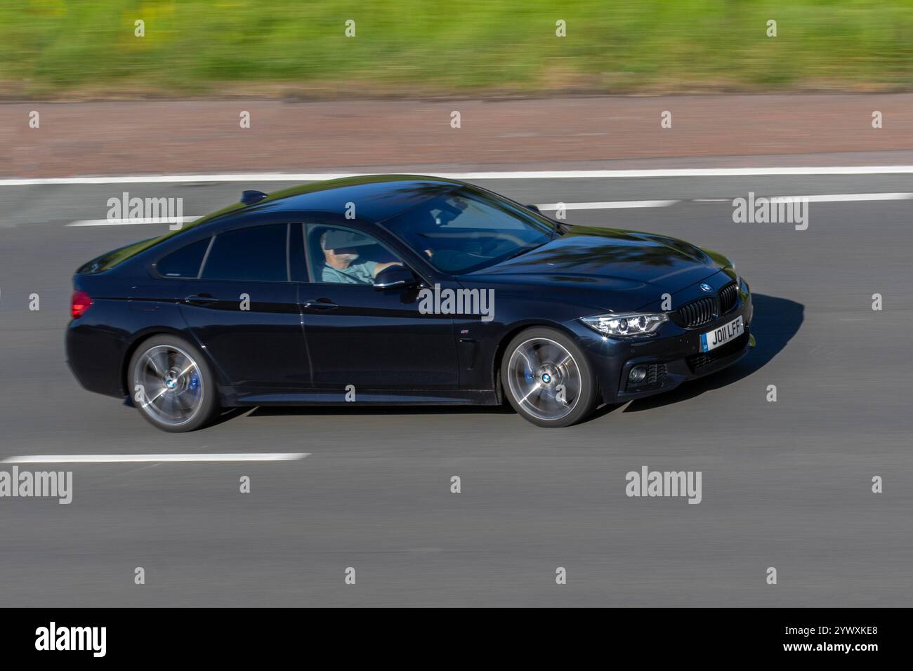 2015 Black BMW 430D Gran Coupe M Sport A, diesel car with a 3.0 litre, 6-cylinder engine and automatic transmission; travelling on the m6 motorway, UK Stock Photo