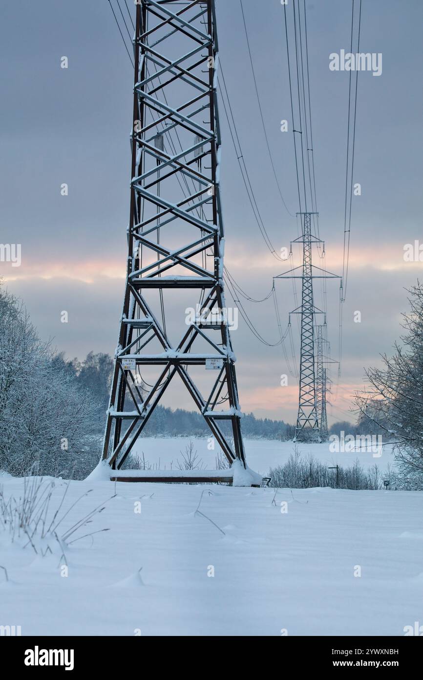 Pylon and power lines on a cloudy winter day Stock Photo - Alamy