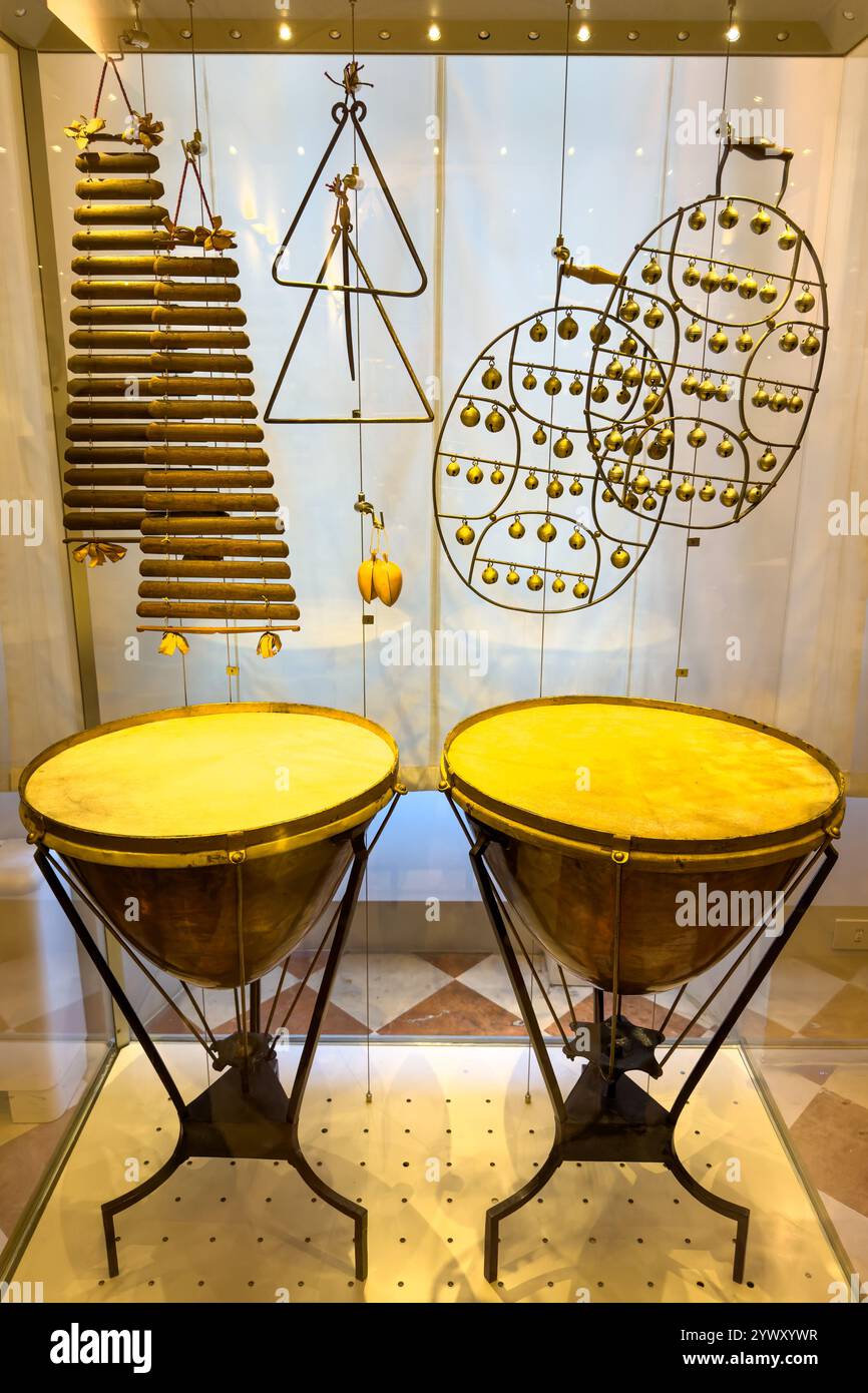 A collection of antique percussion instruments in the Accademia Gallery in Florence, Italy.  Includes kettle-drums or tympani, triangles, castanets, j Stock Photo