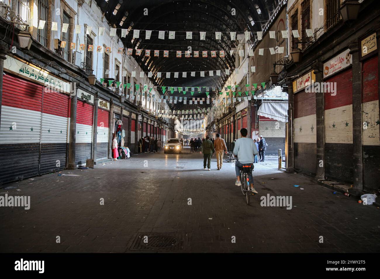 Damascus, Syria. 09 December 2024. A market site with closed shops in ...