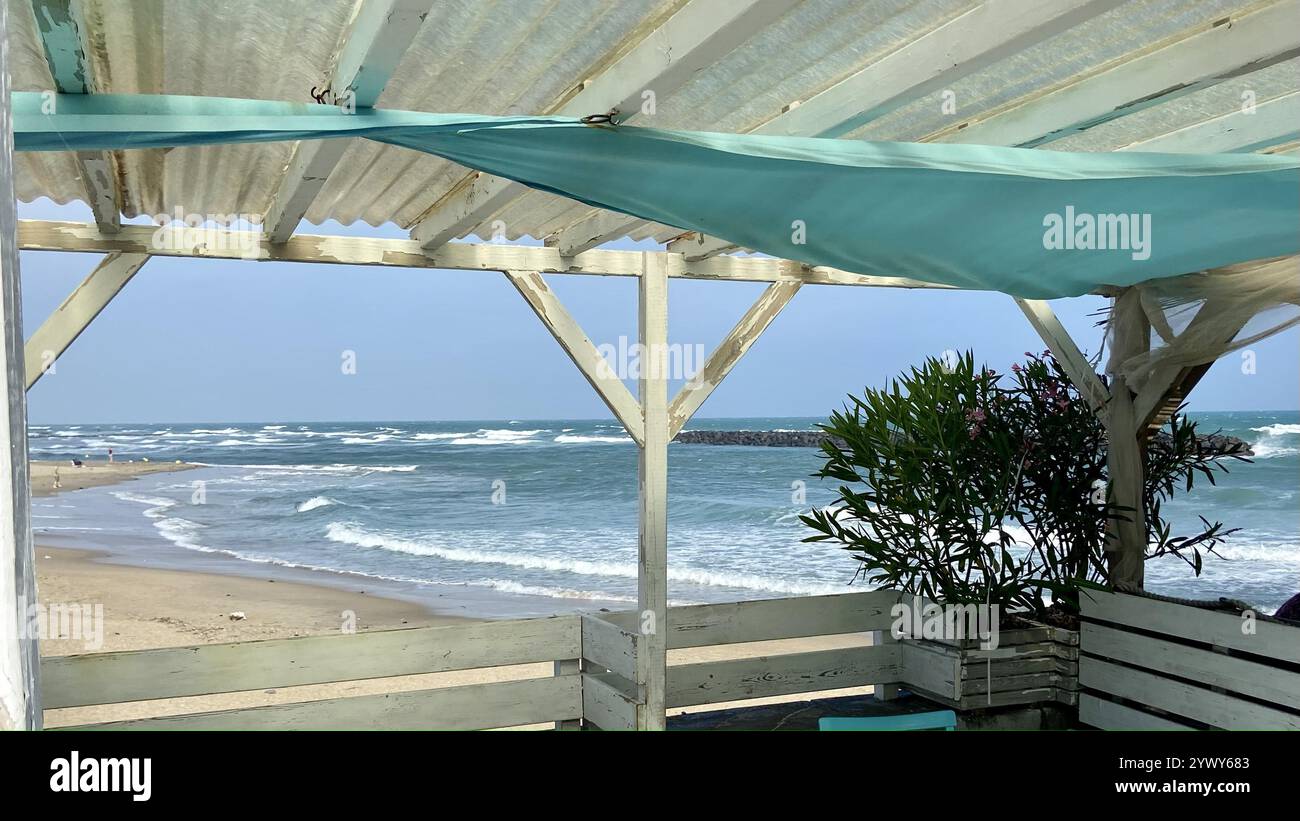 Beautiful view of the coast with waves from a café - Smartphone Captured Stock Image
