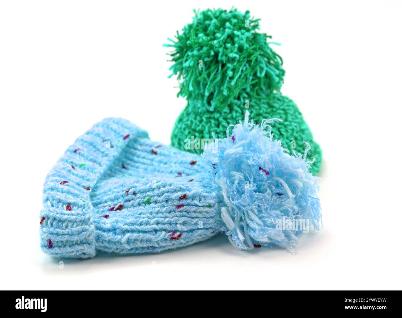 Two bobble hats against a white background Stock Photo