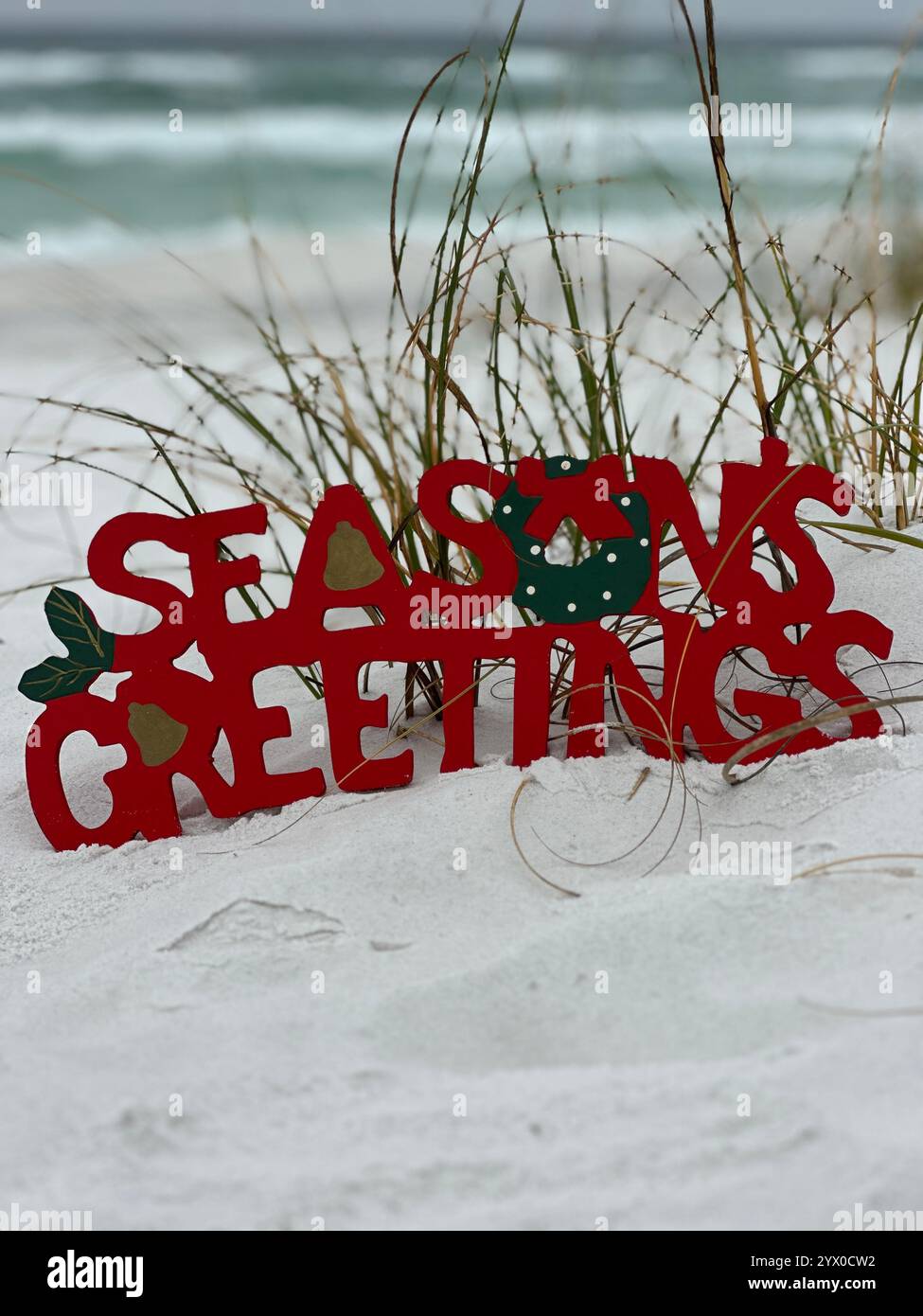 Christmas beach concept with greeting sign - Smartphone Captured Stock Image