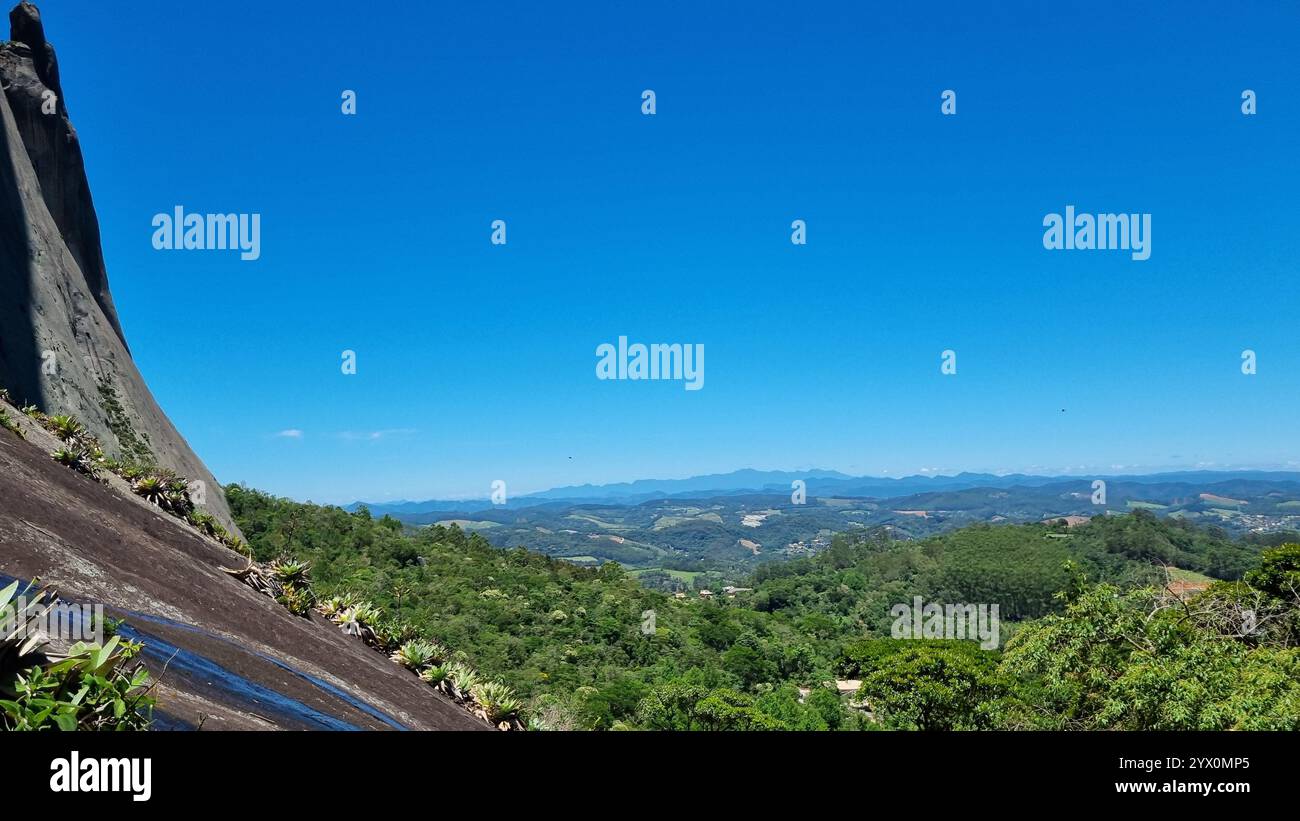 A breathtaking panorama at The Blue Stone Natural Park, where nature meets grandeur under an endless, cloudless blue sky. - Smartphone Captured Stock Image