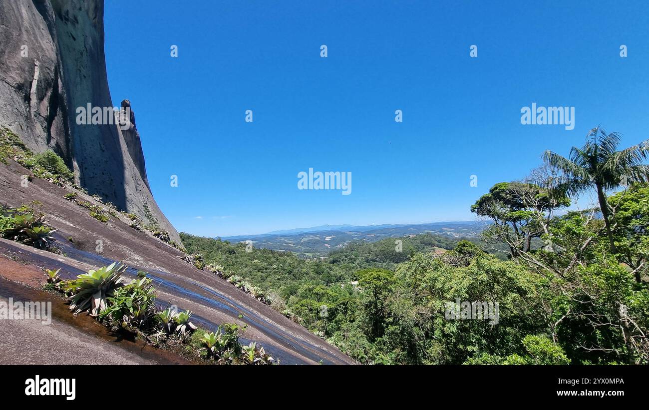 A breathtaking panorama at The Blue Stone Natural Park, where nature meets grandeur under an endless, cloudless blue sky. - Smartphone Captured Stock Image
