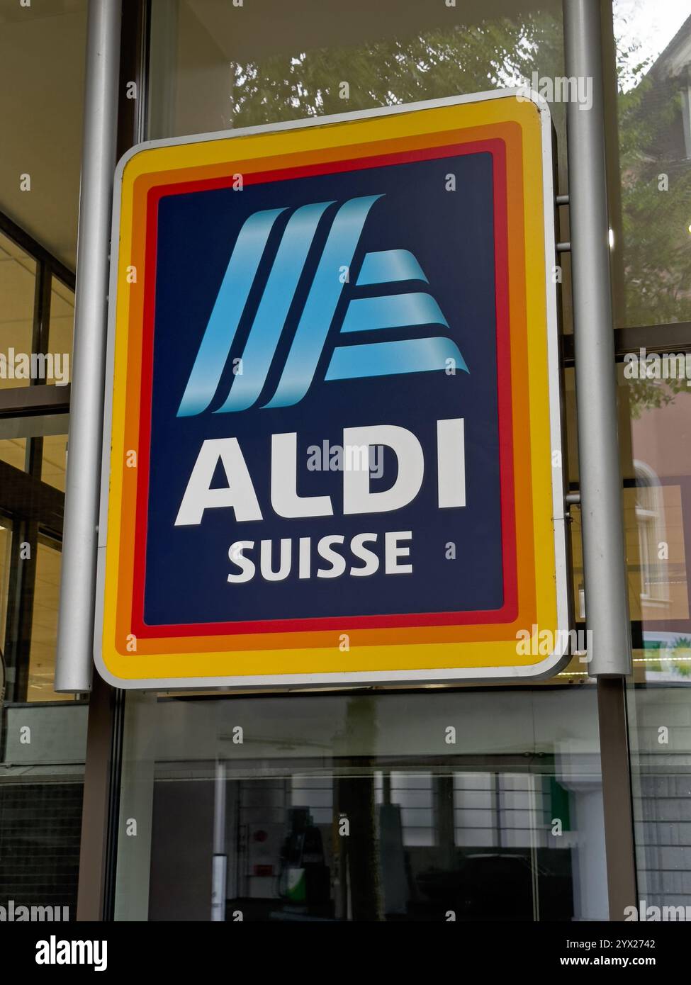 Lucerne, Switzerland - June 25, 2023: An Aldi discount store company logo is shown above the entrance of a retail location during the day. - Smartphone Captured Stock Image