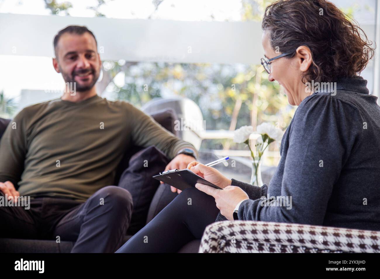 Psychotherapy session, Therapist and client in conversation Stock Photo