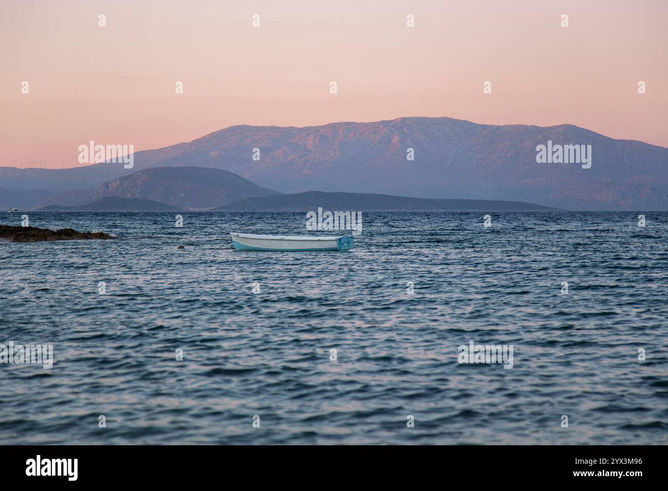 Lonely boat in sea sunset hi-res stock photography and images - Alamy