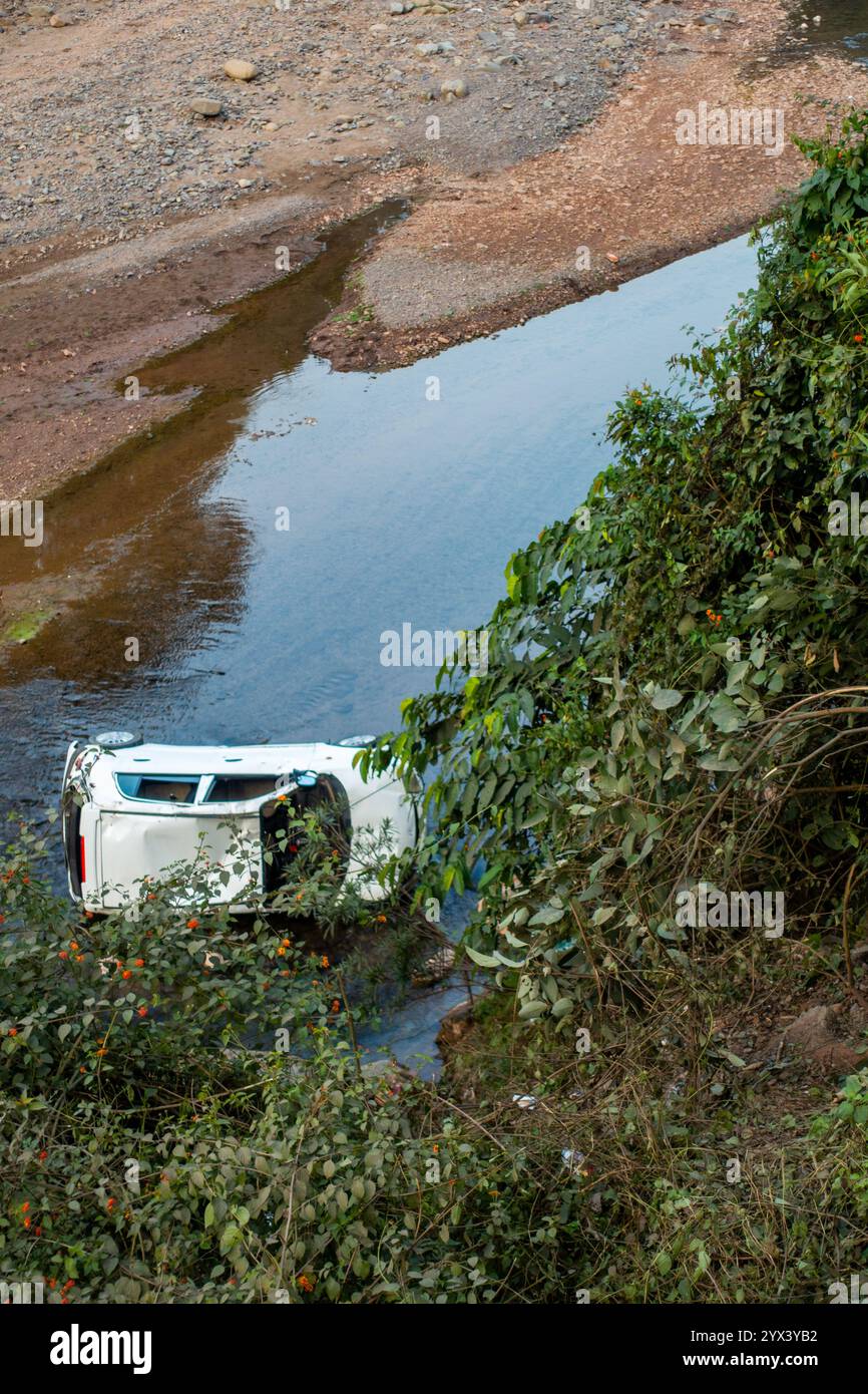 Dce.1st2024 Uttarakhand India. Dramatic scene of a car that plunged into the river after losing control on the winding roads of Uttarakhand, India. Stock Photo