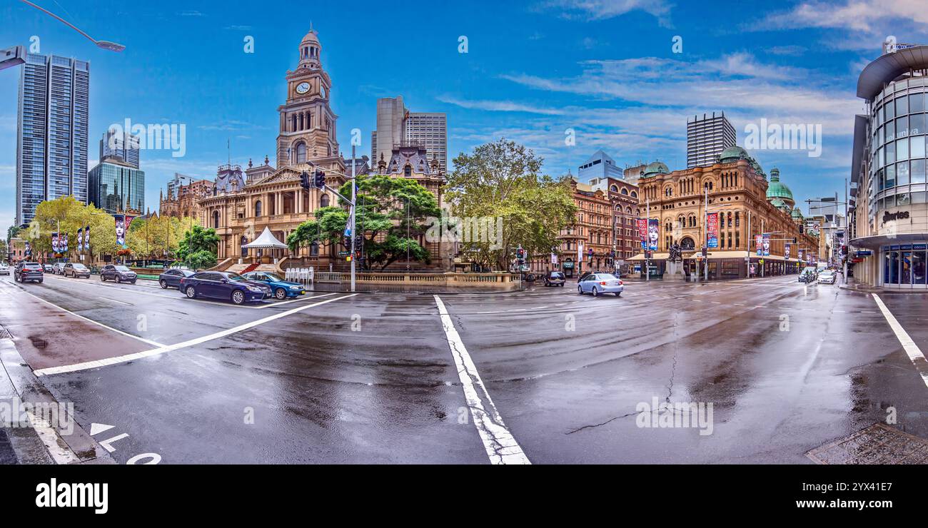 Front view of Sydney Town Hall, a historic landmark with Victorian architecture and a prominent clock tower during daytime Stock Photo