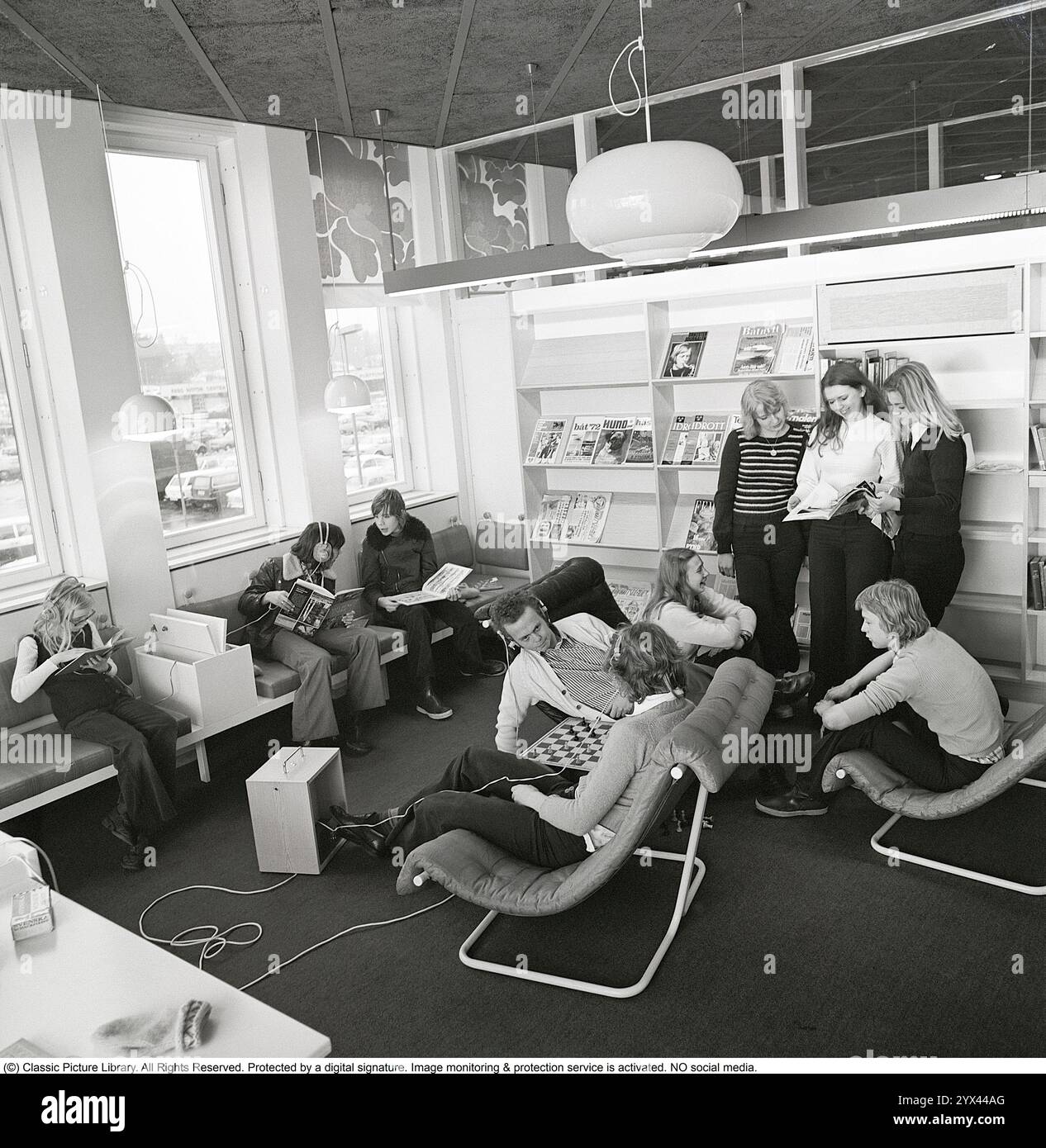 A library in the 1970s. The interior of a library with young people ...