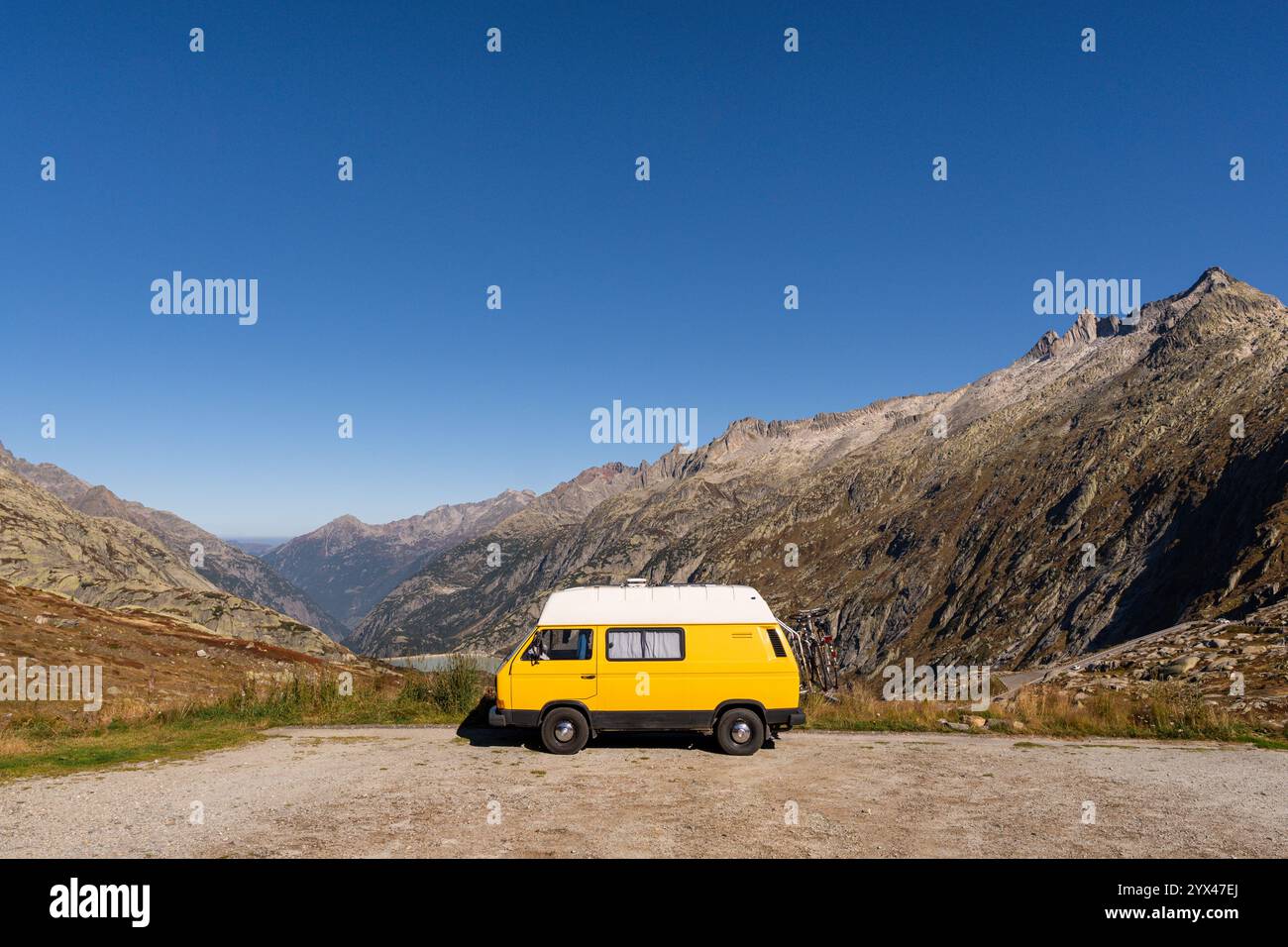 Vintage yellow camper van parked on Grimsel Pass in the Alps Mountains ...