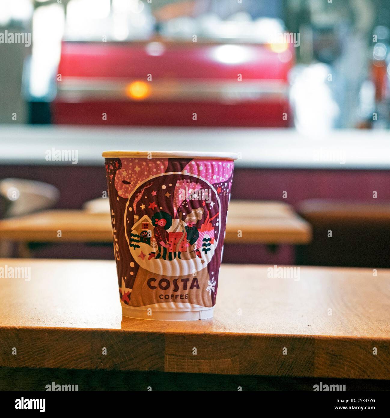 Costa coffee paper cup on table at Christmas Xmas inside Costa shop ...