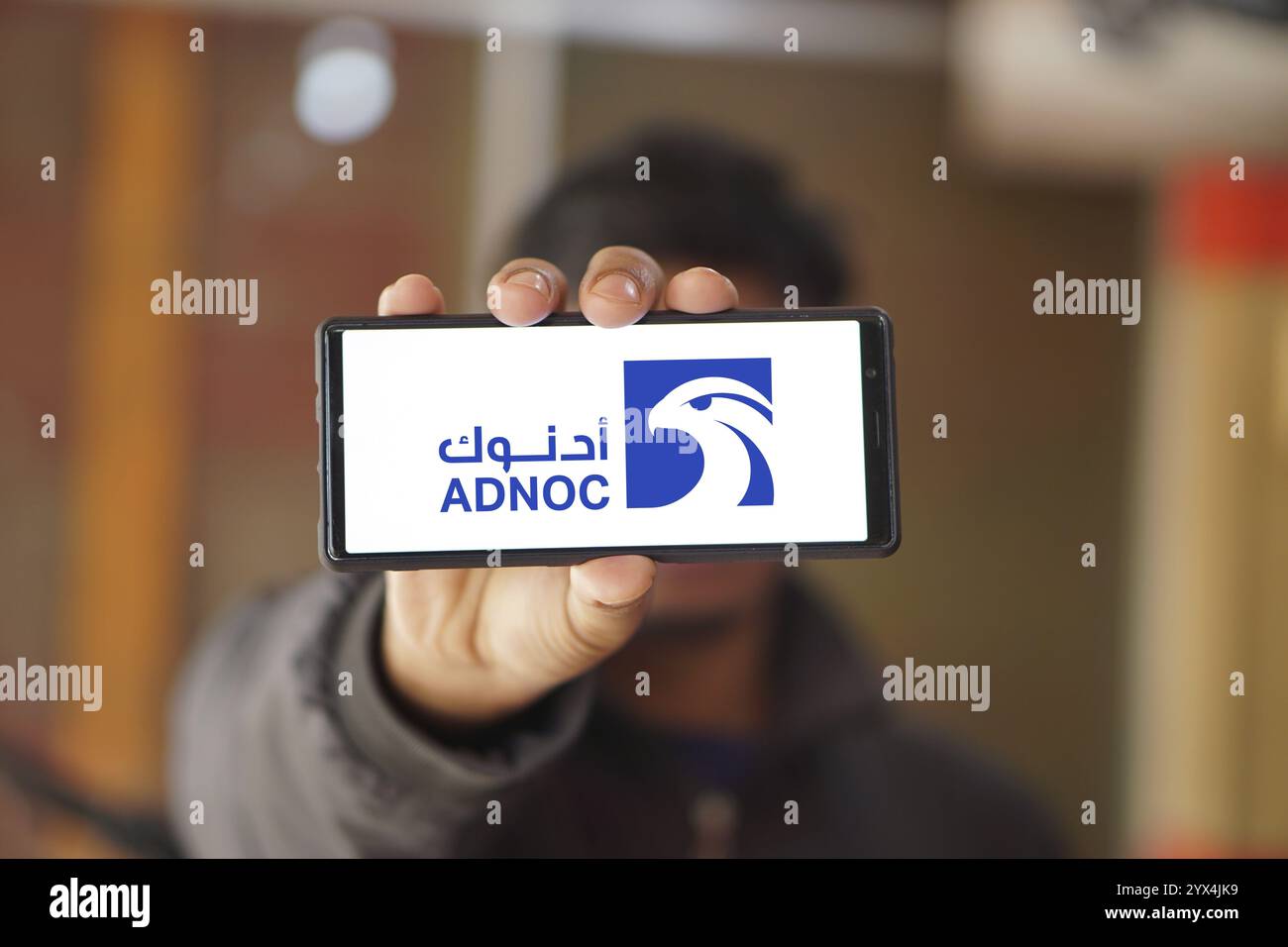 Abu Dhabi National Oil Company (ADNOC) on smartphone Stock Photo - Alamy