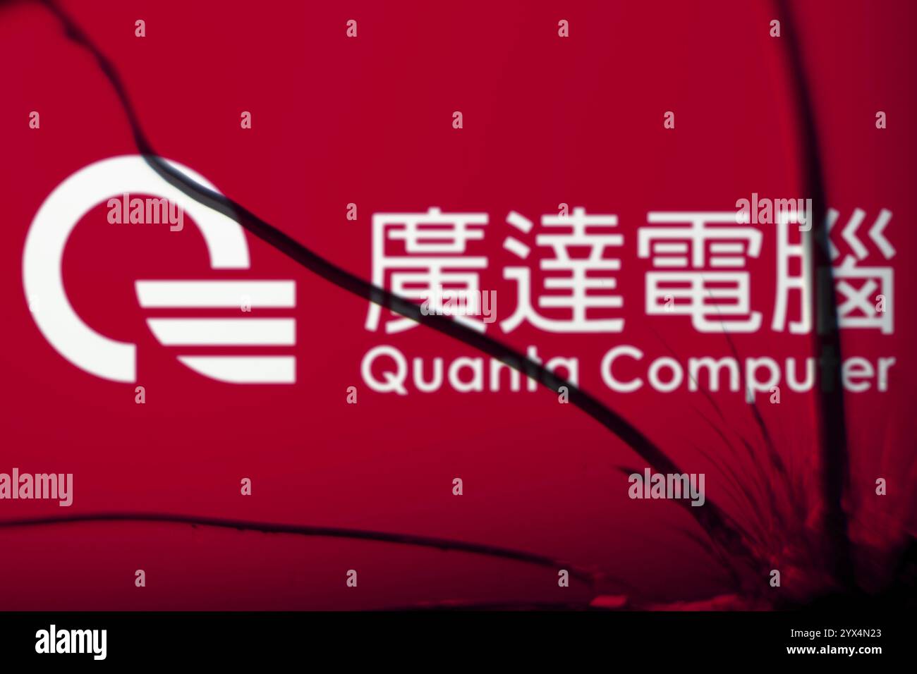 Quanta computer logo is visible on the broken glass. Quanta Computer