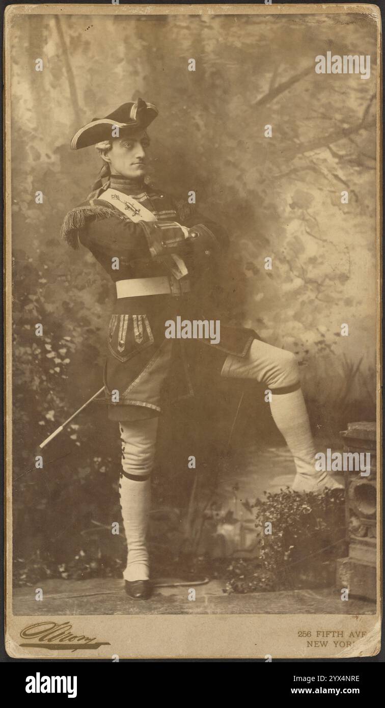 John Drew, Jr. as Captain Plume from &quot;The Recruiting Officer&quot;, 1885. Full length portrait of the actor John Drew, Jr. dressed in an 18th century soldier's costume. He has his arms crossed and is resting one leg on a prop. Stock Photo