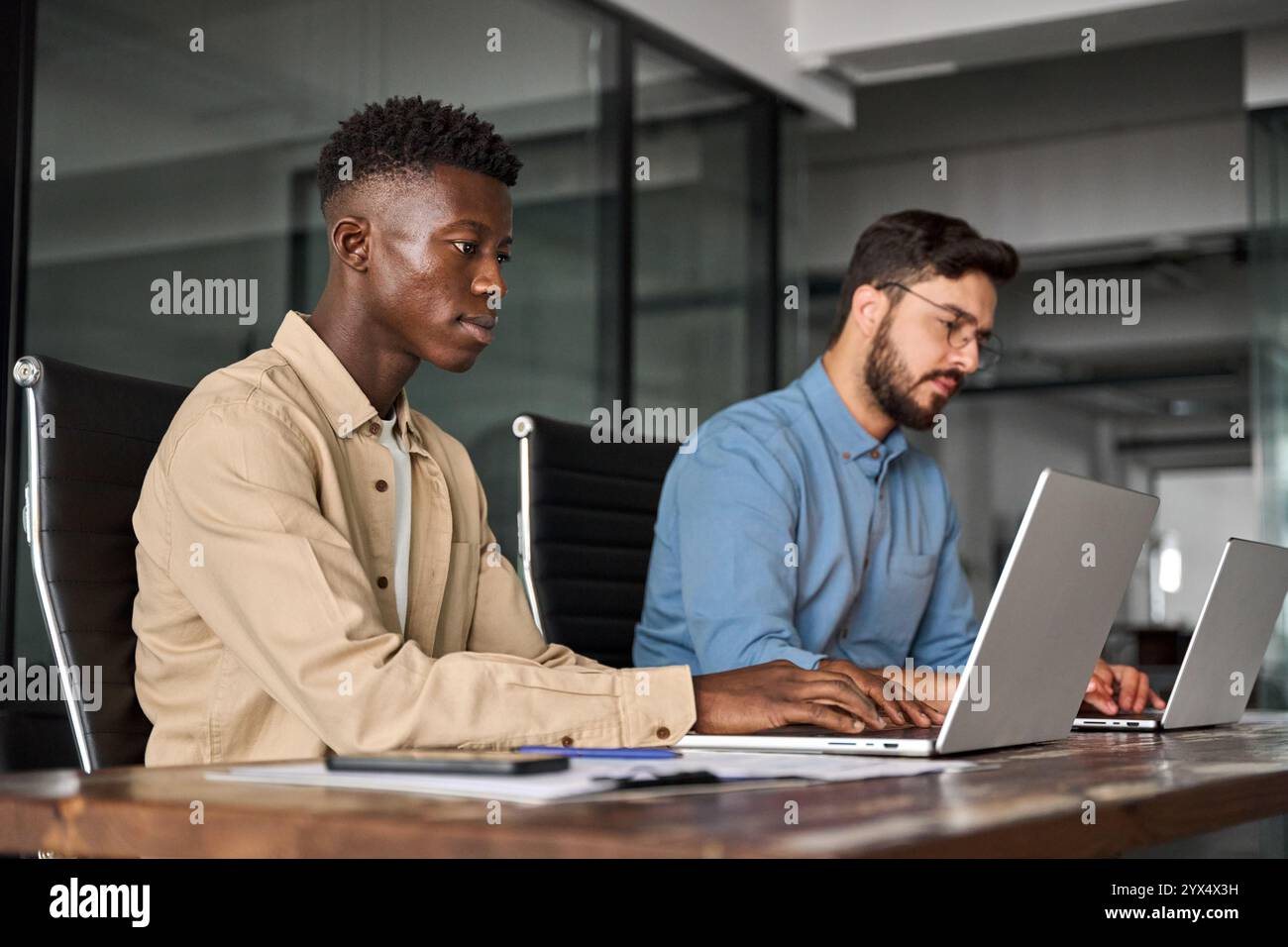 Professional businessmen using laptops hi-res stock photography and ...