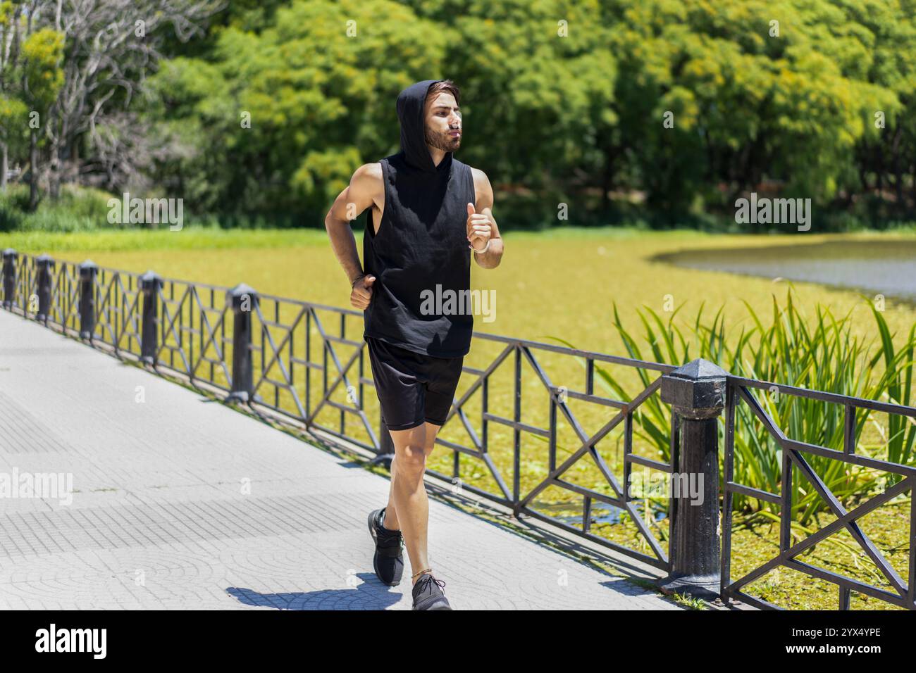 Athletic man running park hi-res stock photography and images - Alamy