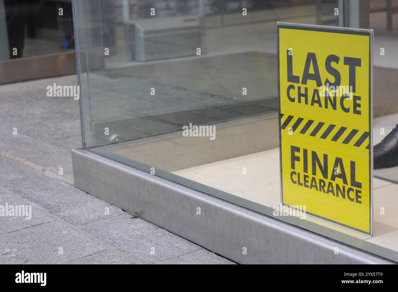 Retail Shop store window with final clearance sale sign on display ...