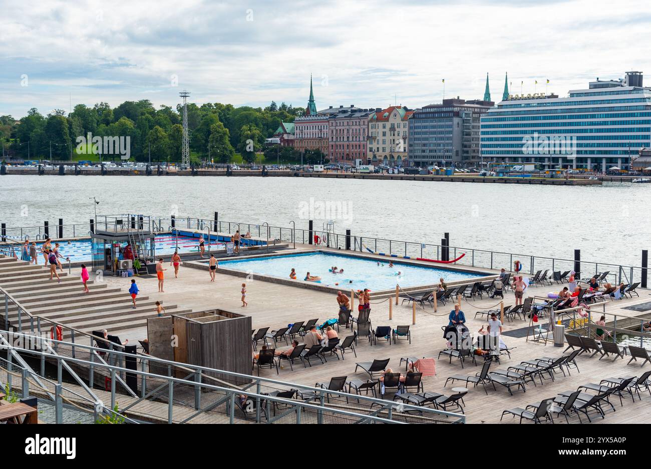 Helsinki, Finland, July 18 2024: People enjoying summer day by swimming and sunbathing at allas sea pool, a floating pool complex in helsinki, finland Stock Photo