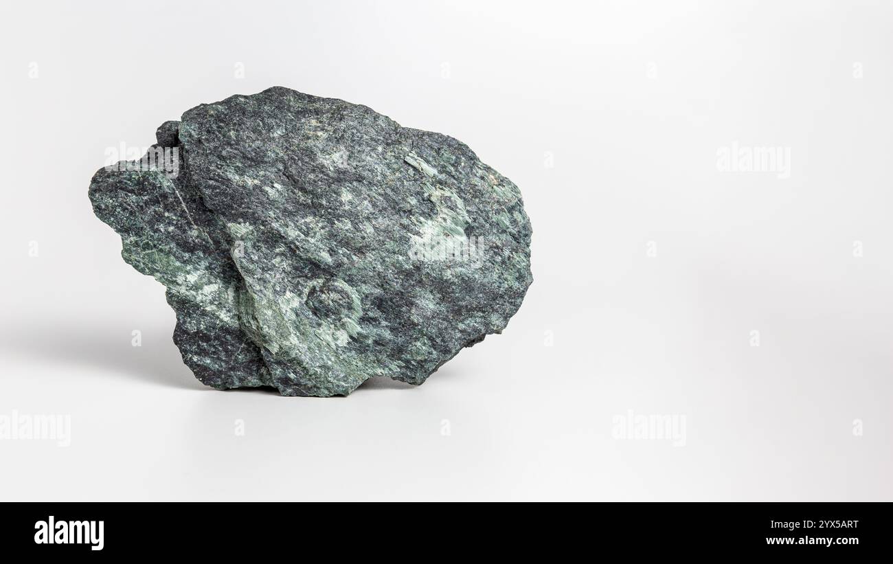 Green stone with mica on white background Stock Photo