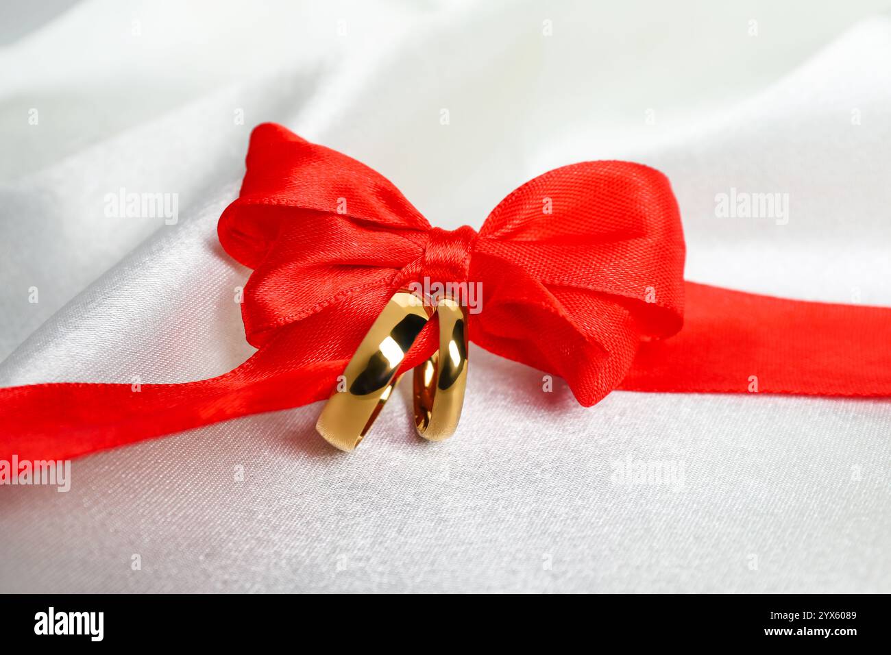 Wedding decoration rings red ribbon hi-res stock photography and images ...