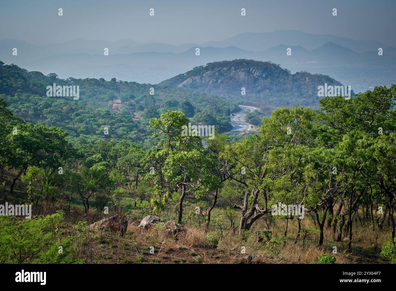 Scenic view of road and forested mountains from Cecil Kop Nature Reserve, Eastern Highlands, Mutare, Manicaland Province, Zimbabwe. Stock Photo