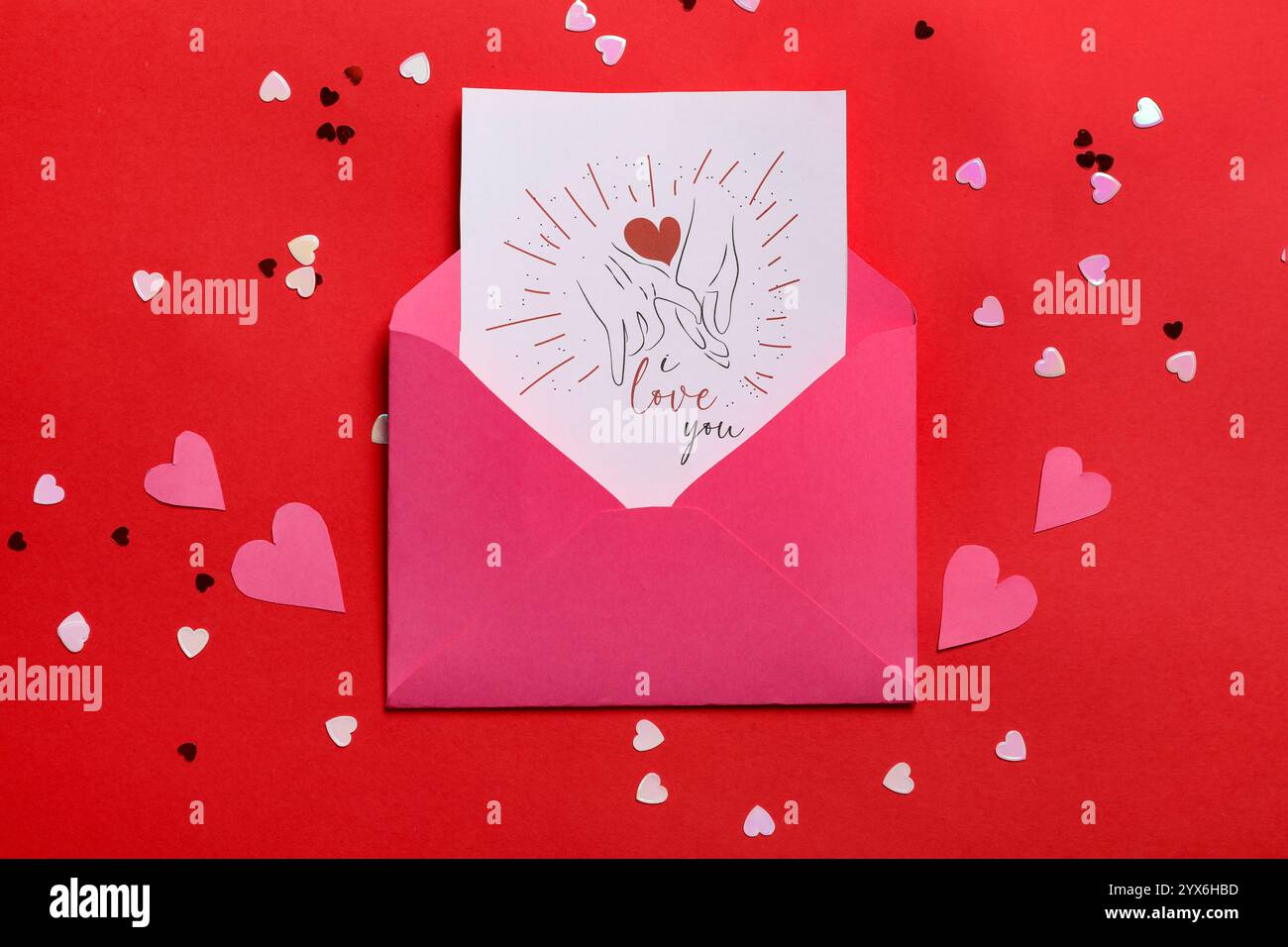 Envelope with gift card and paper hearts on red background. Valentine's ...