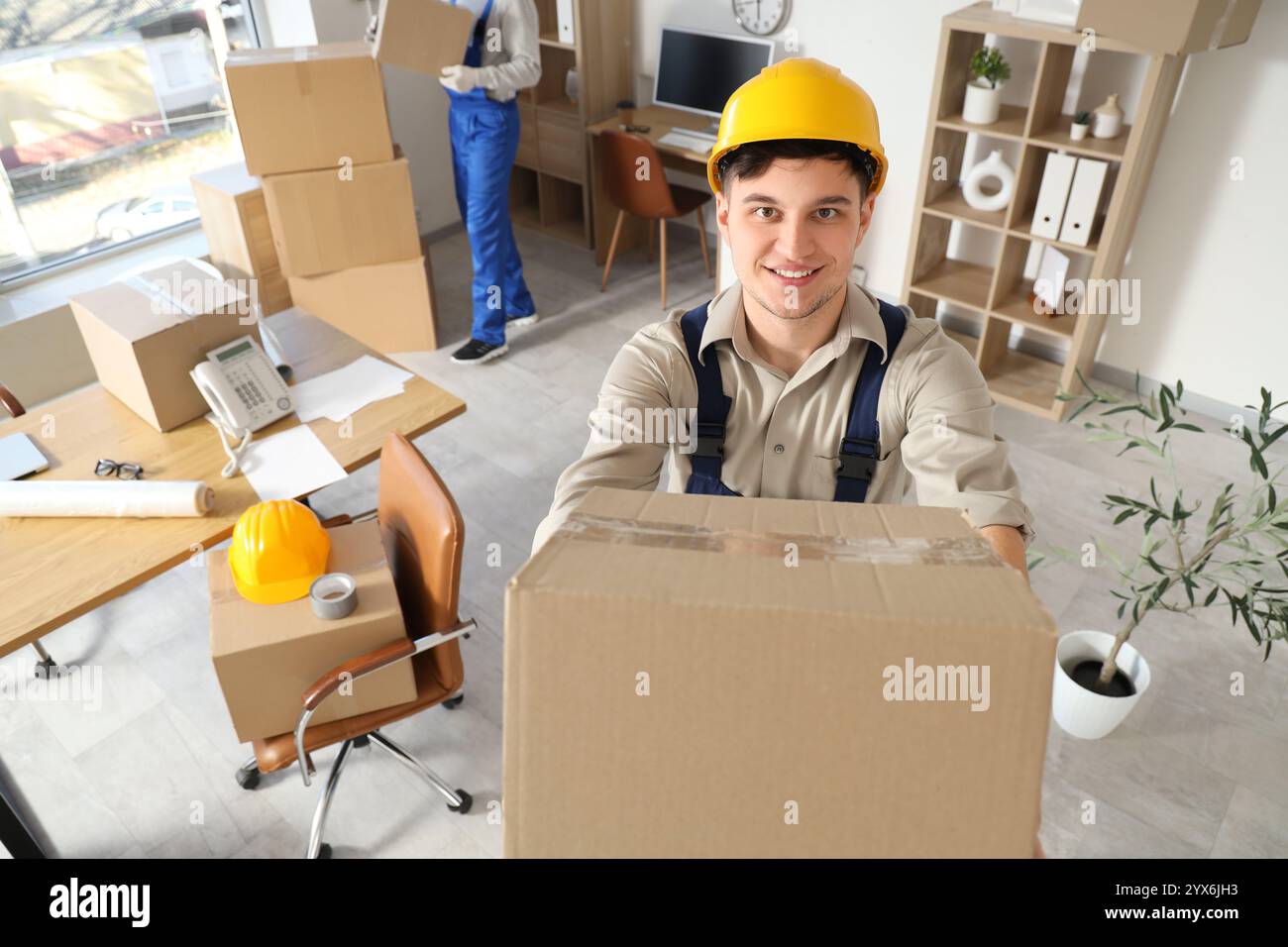 Male loader cardboard box hi-res stock photography and images - Alamy