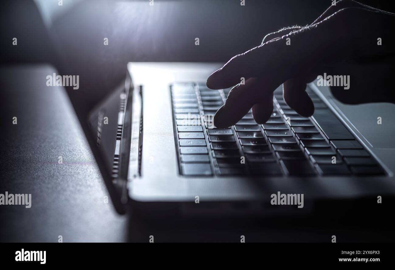 Man working on a laptop computer. Stock Photo