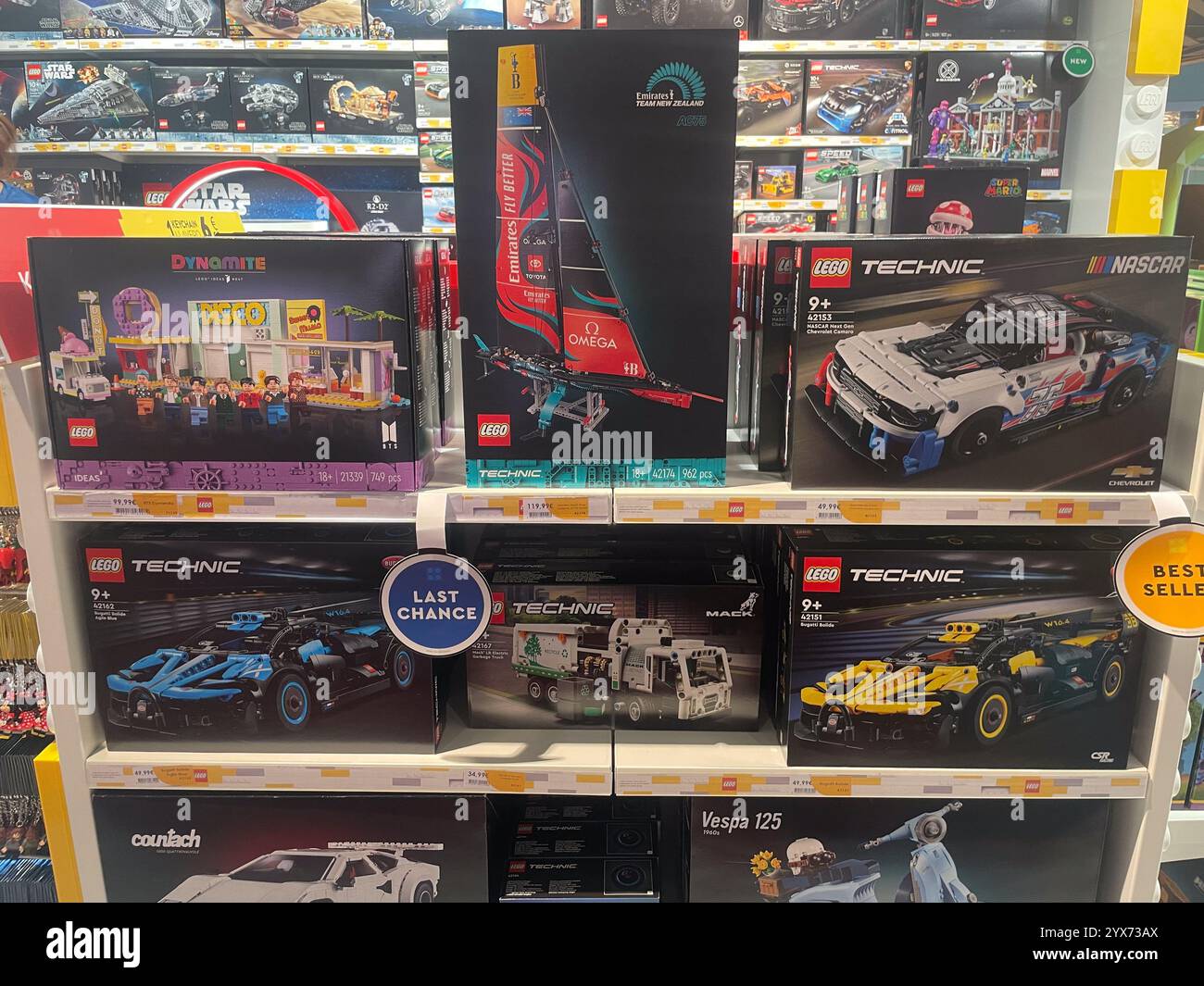 Shelves displaying LEGO sets, including a Lamborghini, Vespa 125, Camaro, Corvette, and Technic models. - Smartphone Captured Stock Image