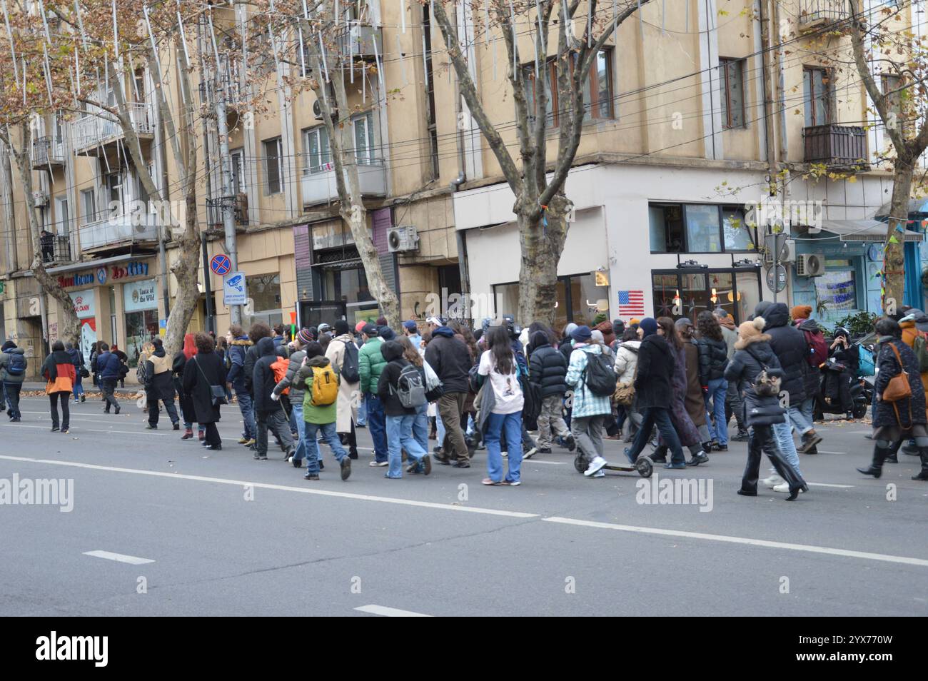 Tbilisi, Georgia - December 12, 2024 - Protesters walking along Merab Kostava Street. (Photo by Markku Rainer Peltonen) Stock Photo