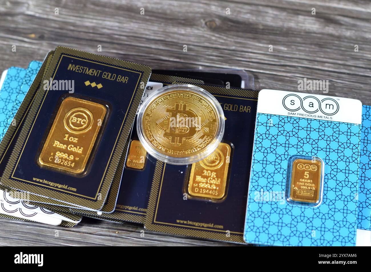 Cairo, Egypt, November 18 2024: Bitcoin physical golden coin, BTC the 1st decentralized cryptocurrency and 24K karat BTC Bullion Trading Center and Sa Stock Photo