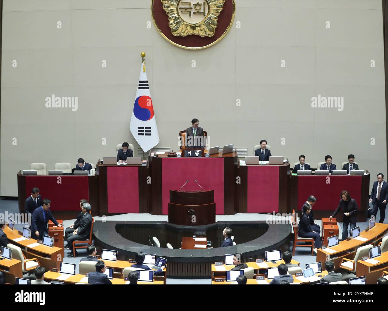 (241214) -- SEOUL, Dec. 14, 2024 (Xinhua) -- South Korean National Assembly lawmakers cast their votes on the impeachment motion against President Yoon Suk-yeol in Seoul, South Korea, Dec. 14, 2024. South Korea's parliament voted Saturday to impeach President Yoon Suk-yeol over his martial law declaration, after the first impeachment motion was dropped a week earlier as the ruling party lawmakers boycotted it. Of 300 lawmakers of the unicameral National Assembly attending the historical plenary session, 204 voted in favor and 85 against with three abstentions and eight voided. (Xinhua/Yao Qi Stock Photo