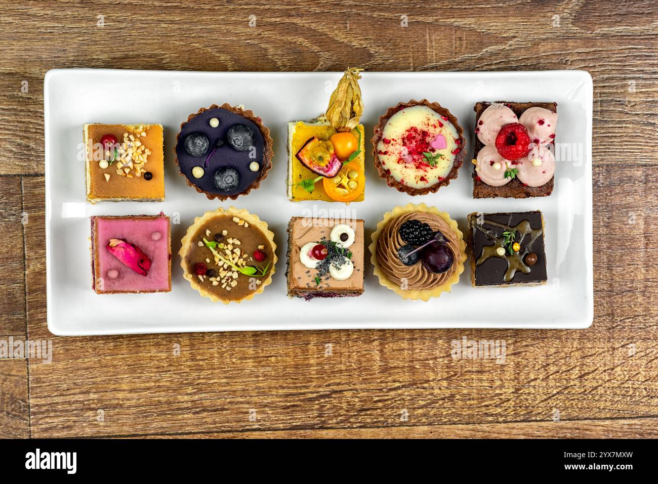 Many various cakes on white plate Stock Photo