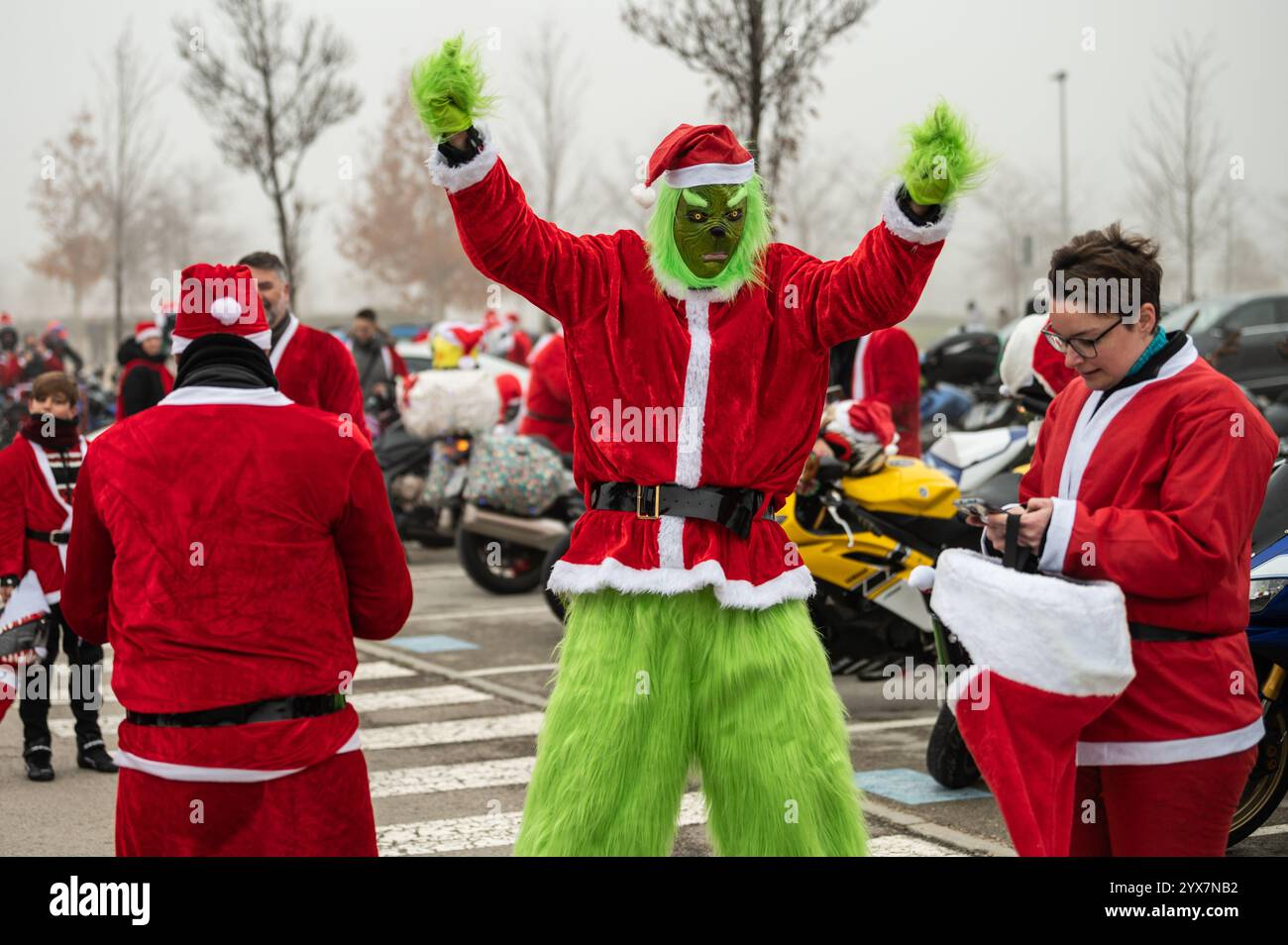 Madrid, Spain. 14th Dec, 2024. A motorcyclist dressed as the Grinch is seen during a gathering ahead of riding to Valencia. Around 400 bikers are traveling to Valencia to deliver Christmas gifts to the children affected by the floods of the last natural disaster in Valencia region the past October, that caused after an intense storm system known as 'Dana' more than 200 deaths in the biggest natural disaster in Spain's recent history. Credit: Marcos del Mazo/Alamy Live News Stock Photo