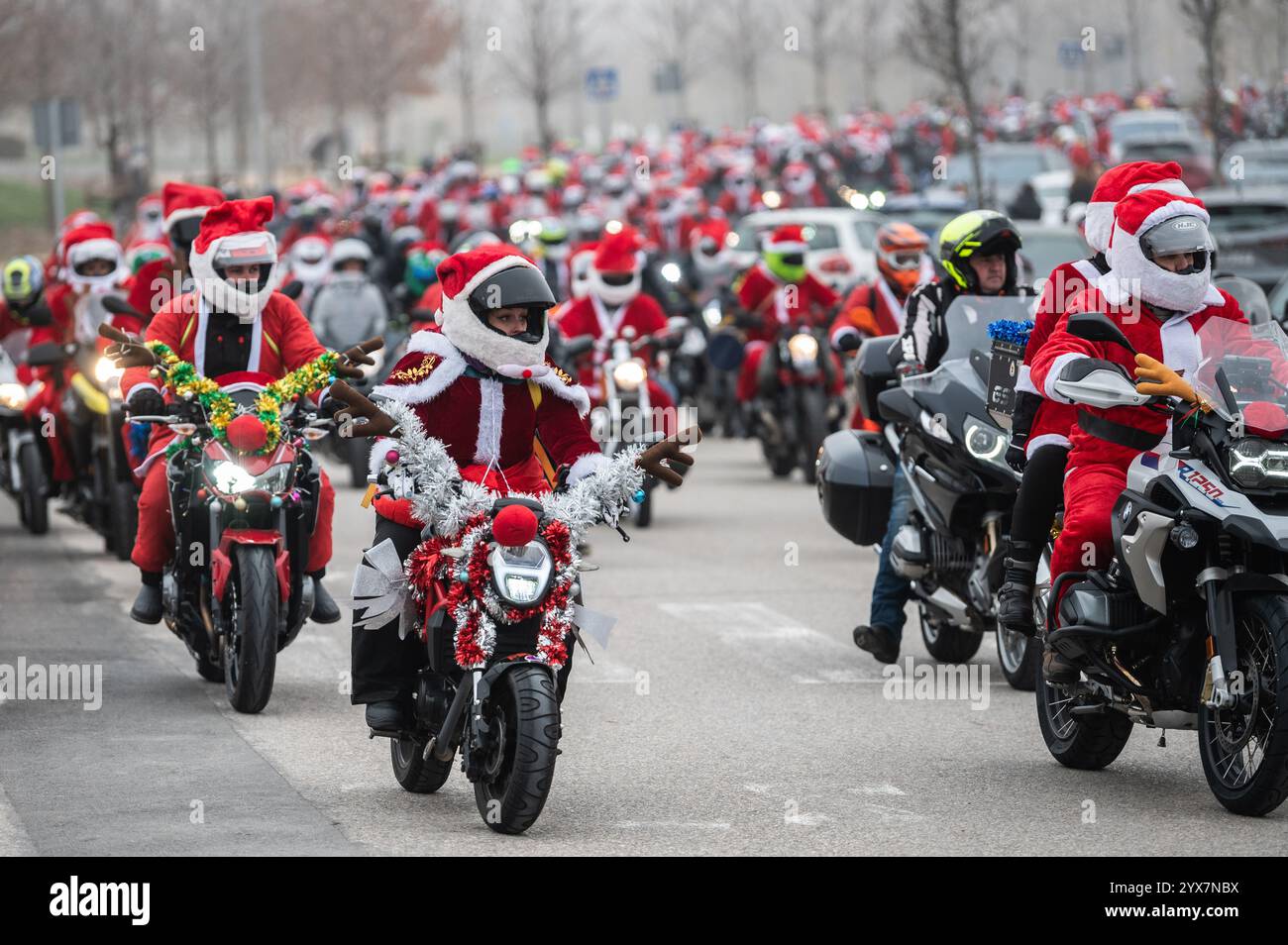 Madrid, Spain. 14th Dec, 2024. Motorcyclists dressed as Santa Claus gathered to ride to Valencia. Around 400 bikers are traveling to Valencia to deliver Christmas gifts to the children affected by the floods of the last natural disaster in Valencia region the past October, that caused after an intense storm system known as 'Dana' more than 200 deaths in the biggest natural disaster in Spain's recent history. Credit: Marcos del Mazo/Alamy Live News Stock Photo