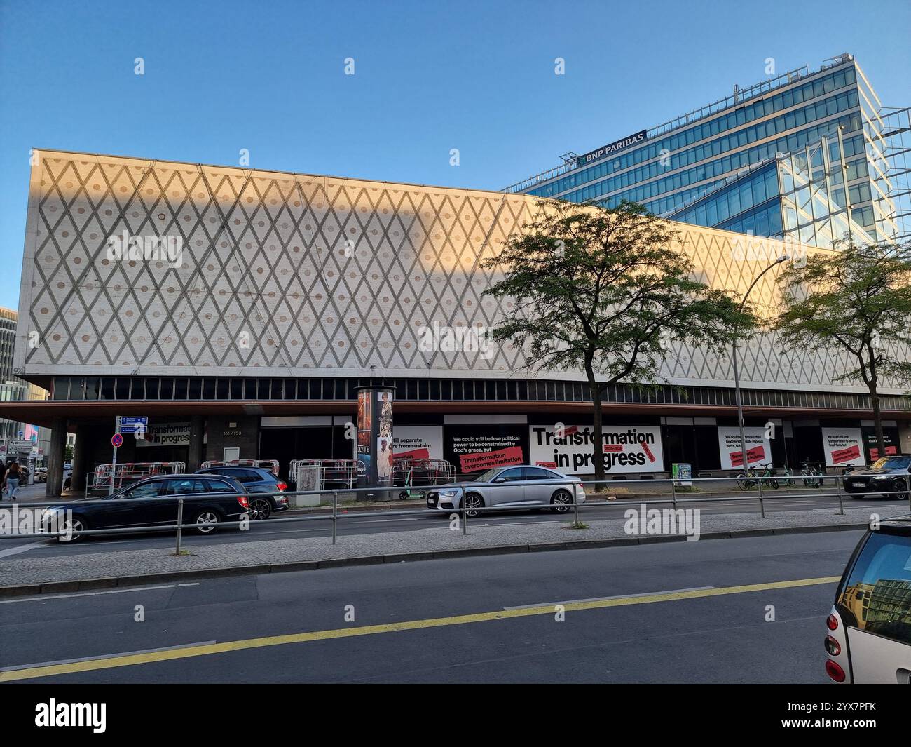 Former Karstadt department store (Karstadt Sports) on Joachimsthaler Strasse, Berlin w/ banner text 'Transformation in progress' seen from Kantstrasse - Smartphone Captured Stock Image