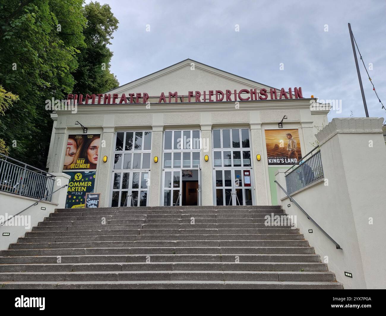 Facade of the Filmtheater am Friedrichshain (movie theatre, cinema, film theatre) in Berlin, Germany, with movie posters; stairs - Smartphone Captured Stock Image