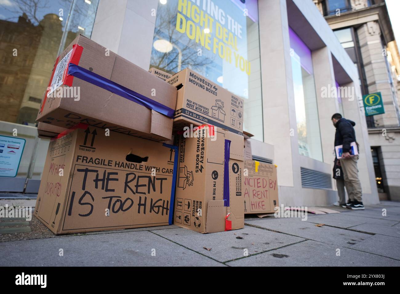 Empty cardboard boxes outside Foxtons in London, following a protest against soaring rents. Organised by the London Renters Union (LRU) who have said there is a growing wave of renter-led demonstrations across Europe to highlight the impact of high rents and to demand controls. Picture date: Saturday December 14, 2024. Stock Photo