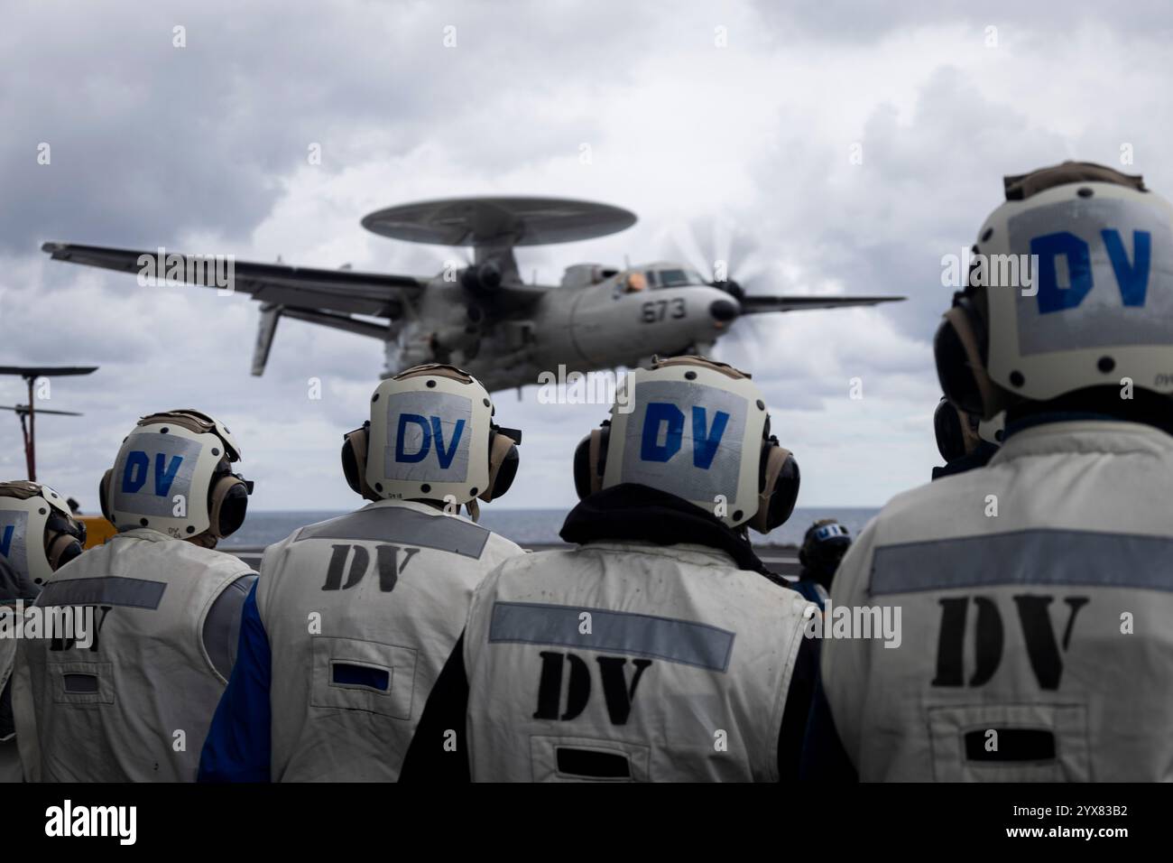 Distinguished visitors from the Colorado Thirty Group watch an E-2D Hawkeye, attached to the 'Greyhawks' of Airborne Command and Control Squadron (VAW Stock Photo