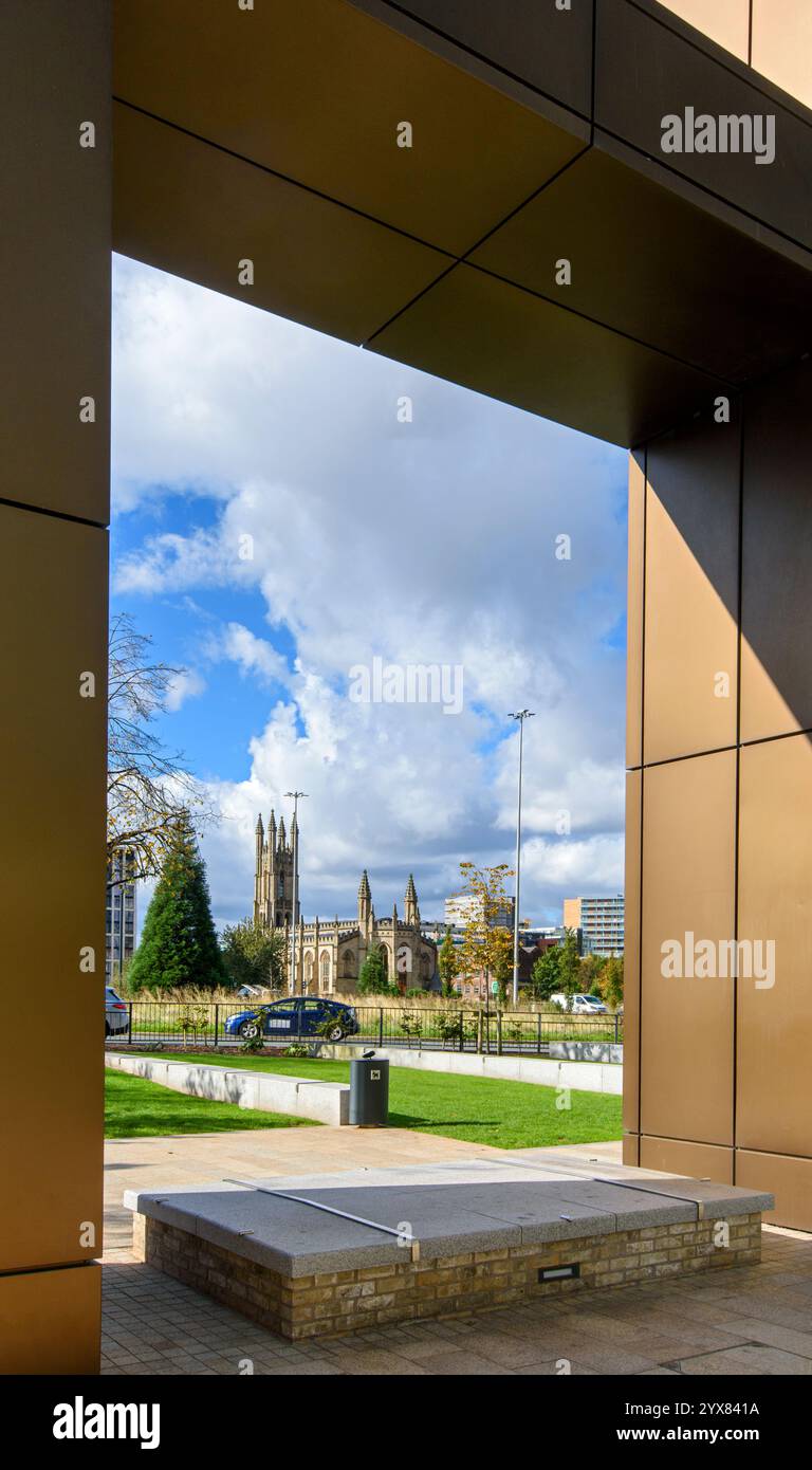 The Church of St George (now converted to apartments), from the entrance to the Elizabeth Tower, Crown St. Chester Road, Manchester, England, UK. Stock Photo