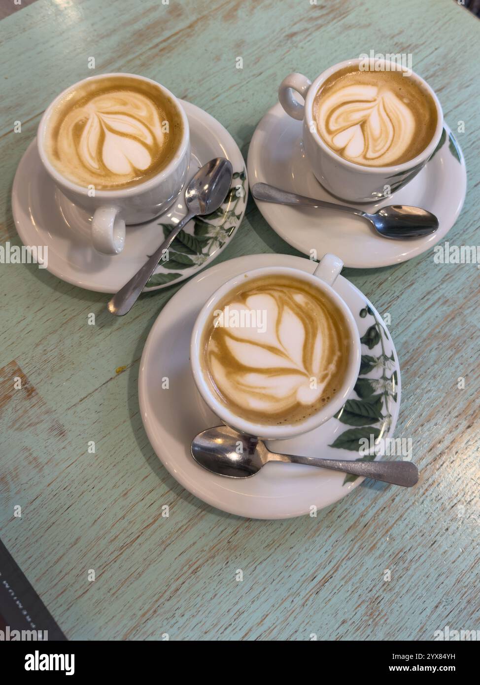 Coffee art three cups cappuccino hi-res stock photography and images - Alamy