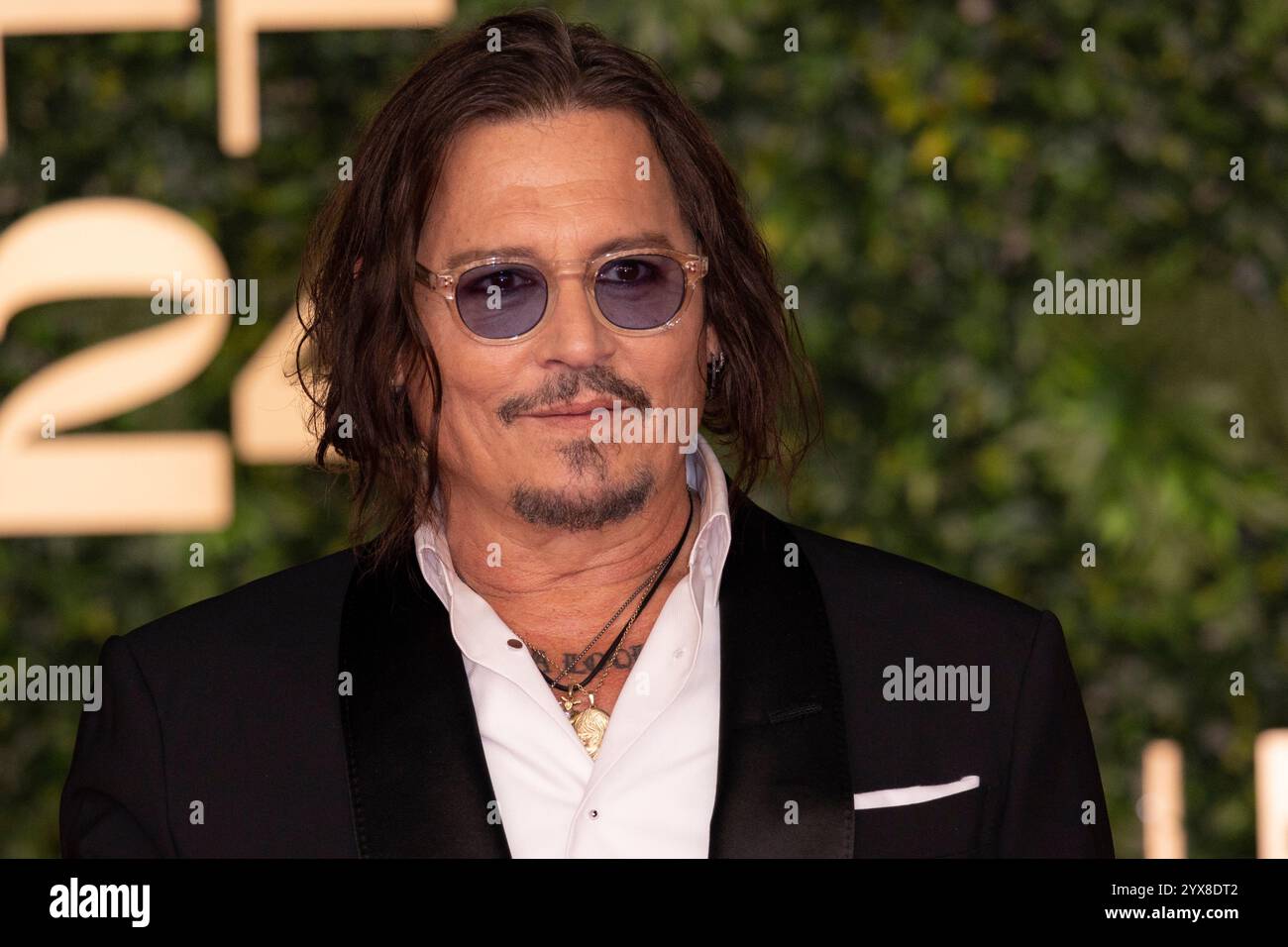 Johnny Depp poses for photographers for the Closing Ceremony red carpet