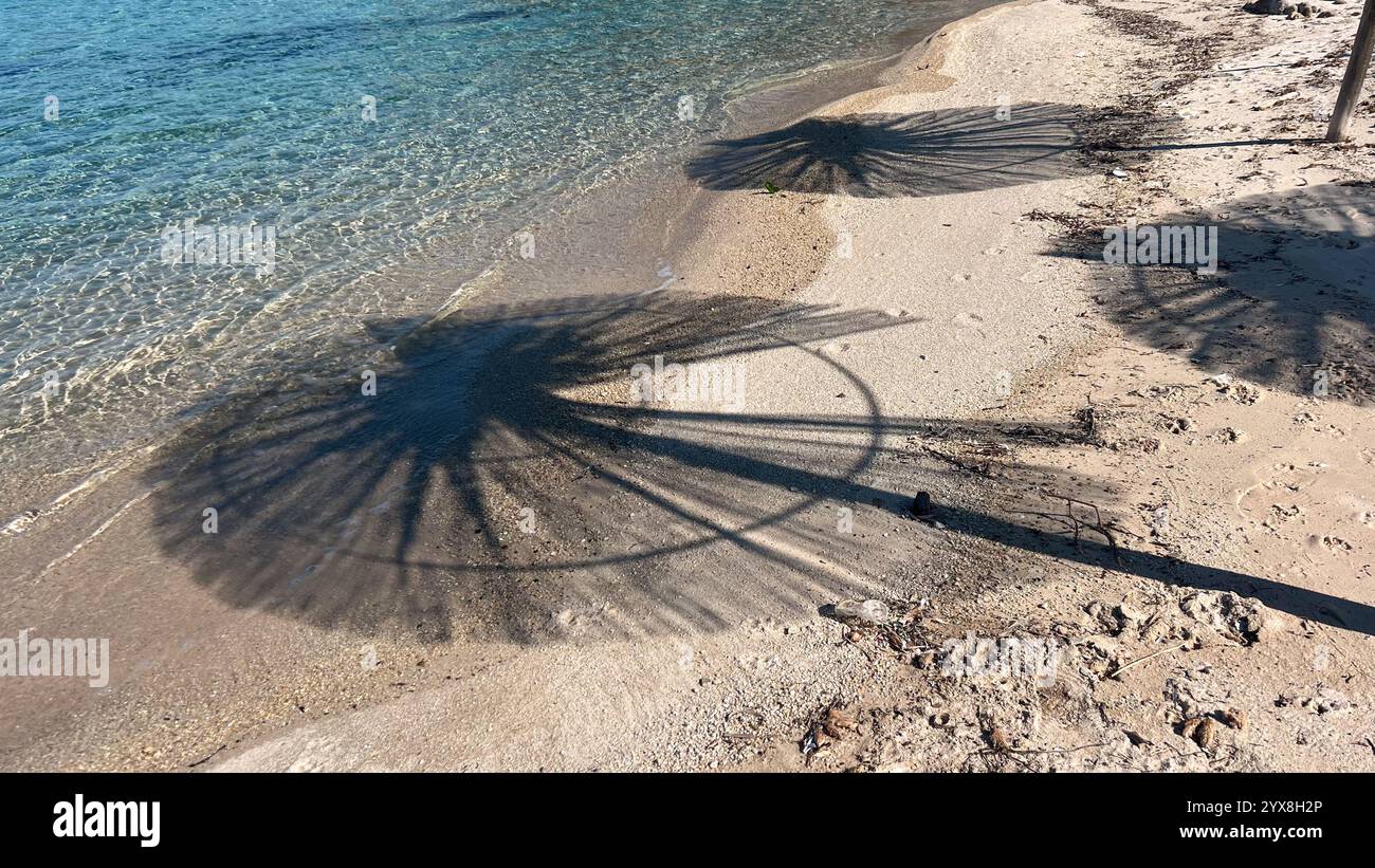 Beach bar with umbrellas in Greece at summer time - Smartphone Captured Stock Image